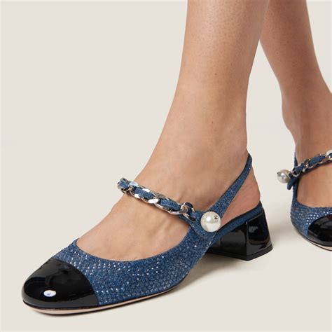 Denim and patent leather slingback pumps with artificial crystals